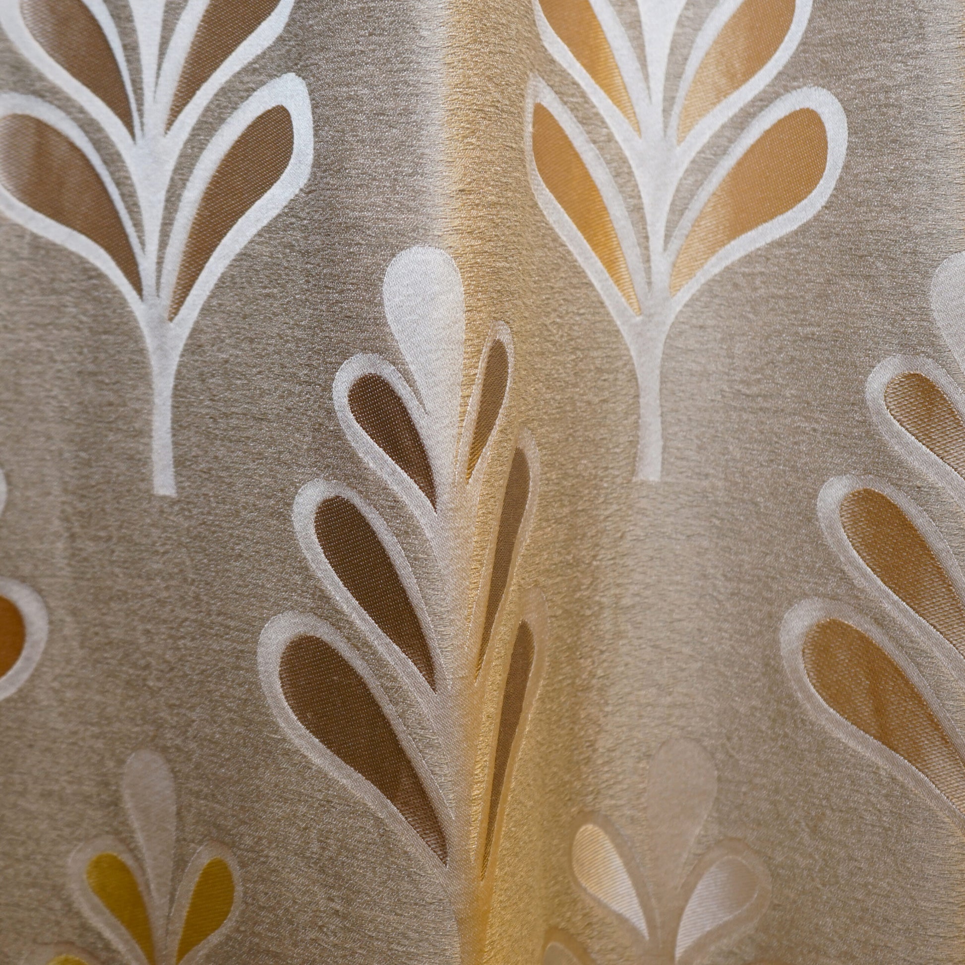 Beige damask-style fabric with white-outlined partridge leaf motifs and gold-brown teardrop shapes; upholstery fabric.