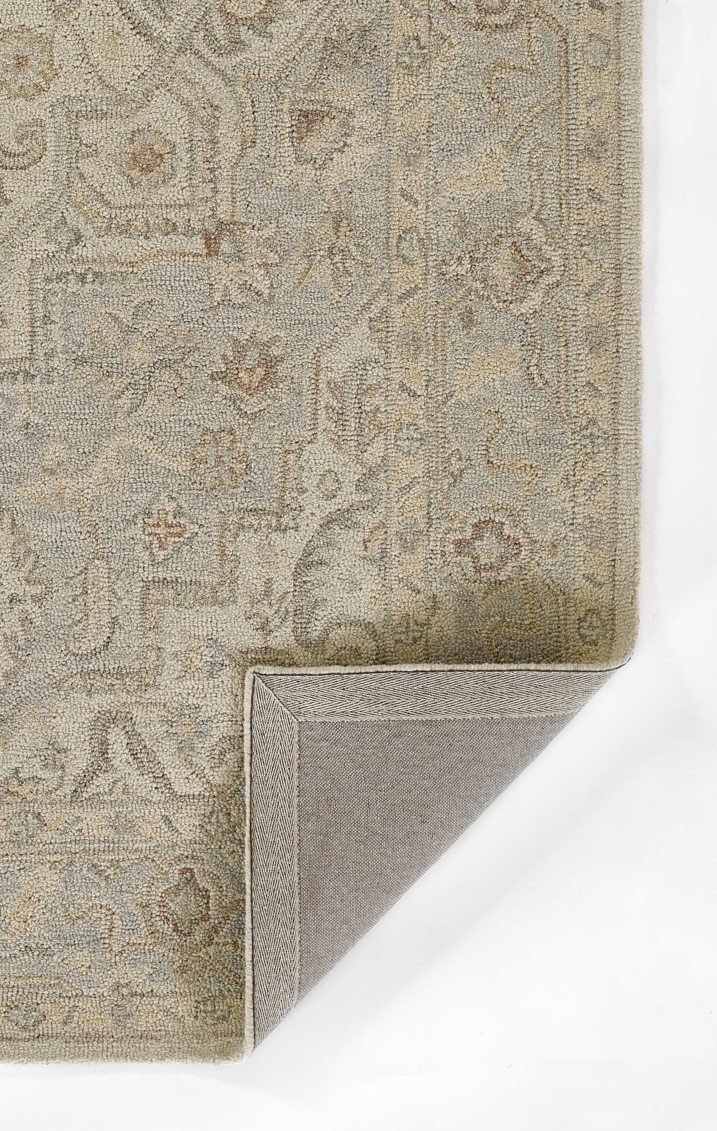 Beige-gray patterned runner rug with subtle damask floral motifs; corner lifted to reveal gray backing.