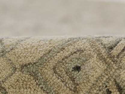 Close-up of a beige taupe woven rug with a looped pile and subtle geometric pattern.