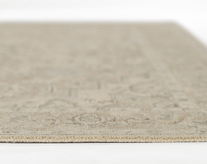 Taupe rug with subtle geometric pattern, low-pile flat weave, neutral beige tones for living room or hallway.