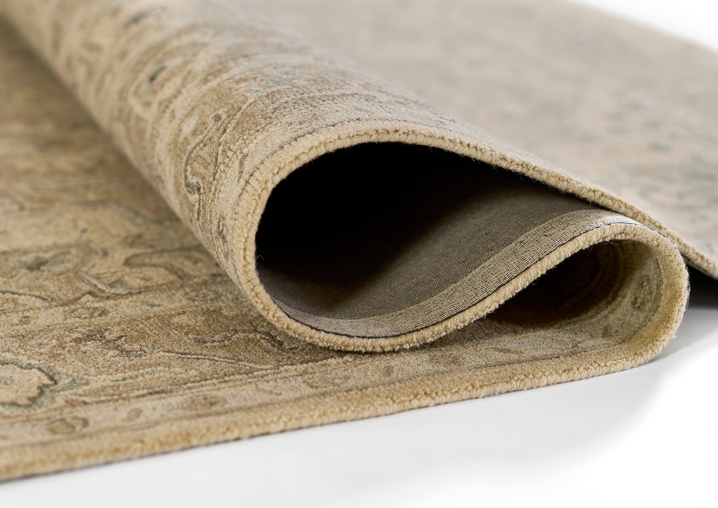 Taupe Persian-style runner rug, rolled at the edge, plush pile with ornate beige patterns.