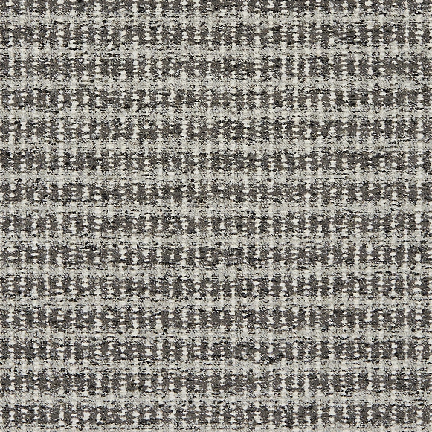 Gray and silver boucle jacquard textured fabric; upholstery material for sofas or cushions.