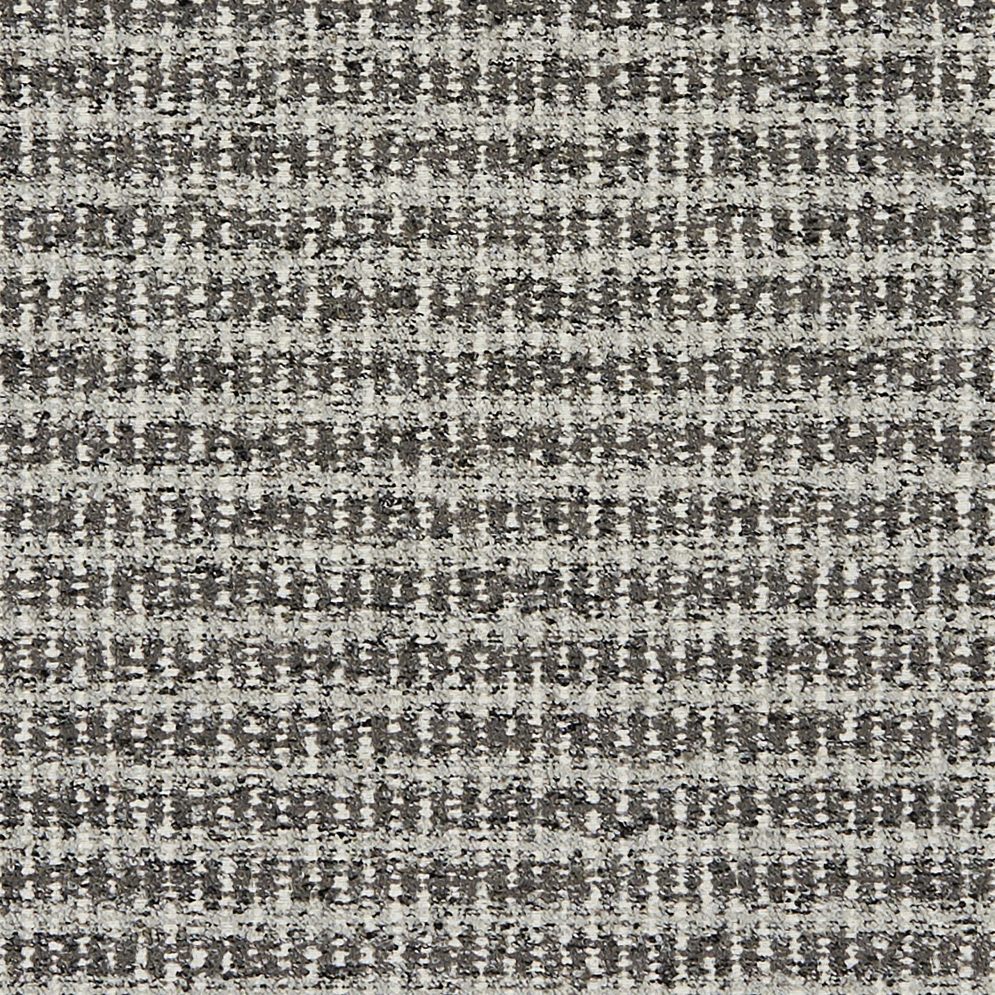 Gray and silver boucle jacquard textured fabric; upholstery material for sofas or cushions.