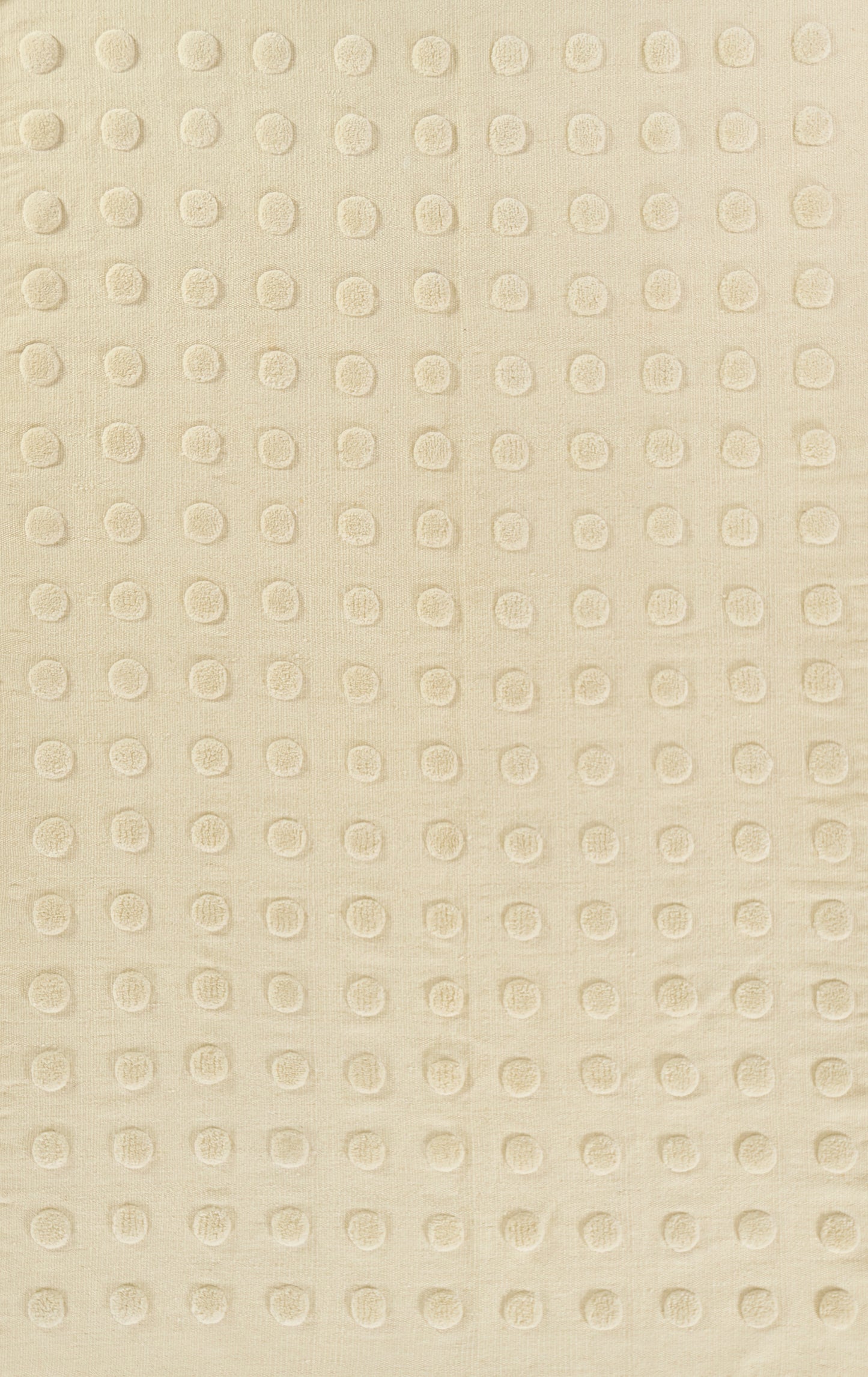 Cream fabric with a regular raised circular dot grid texture, soft and versatile for upholstery or bedding.