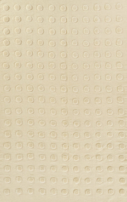 Beige fabric with tiny raised circular dots in a neat grid, soft texture for upholstery or wallpaper.
