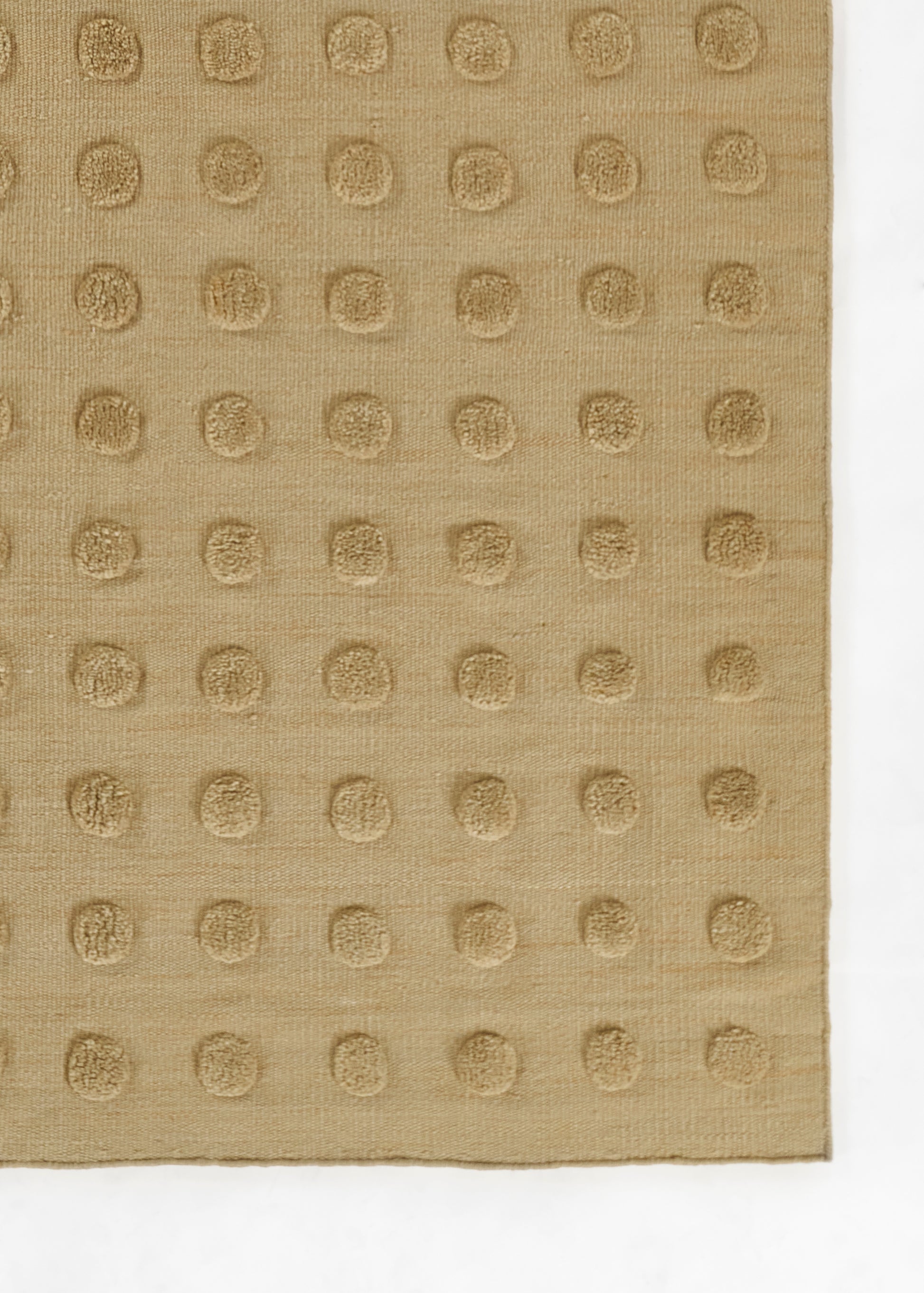 Taupe fabric swatch with a grid of embossed circular dots on a textured woven surface.