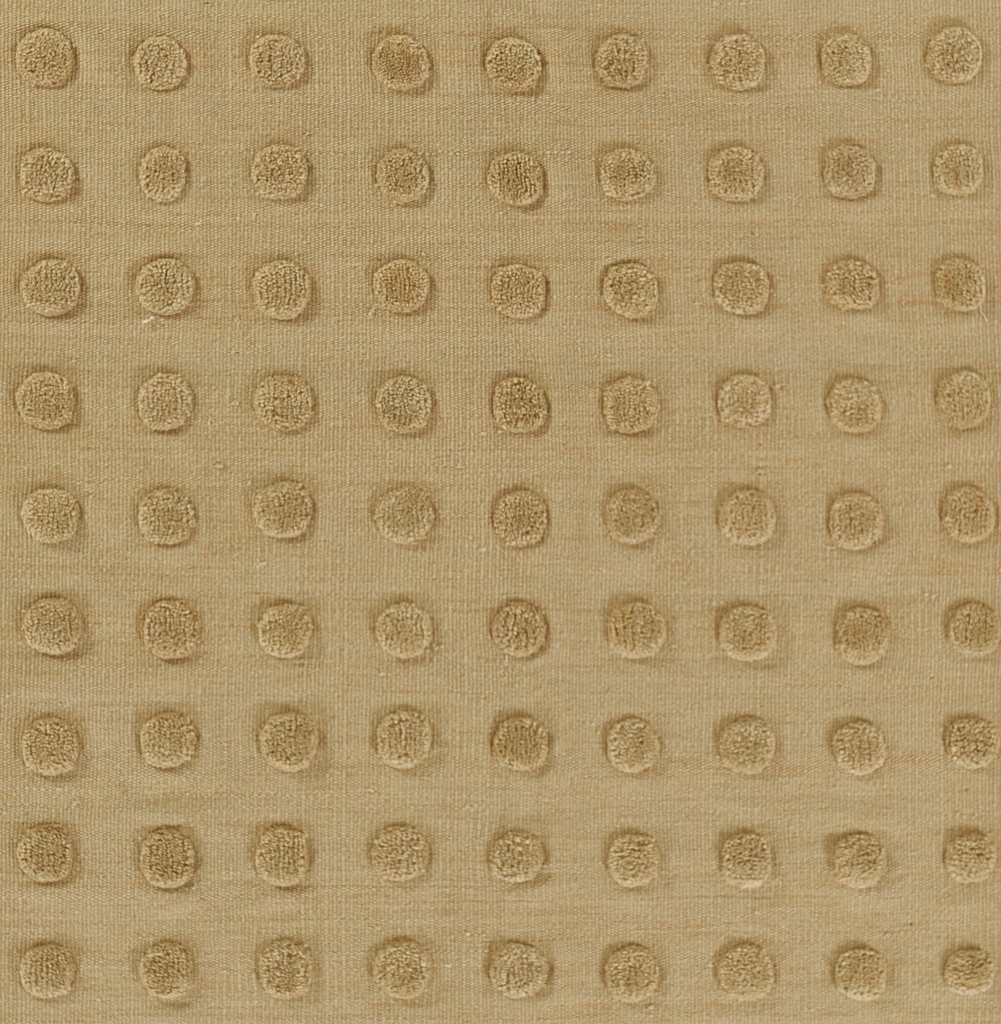 Taupe fabric with raised circular dots in a grid, creating a textured dotted pattern.