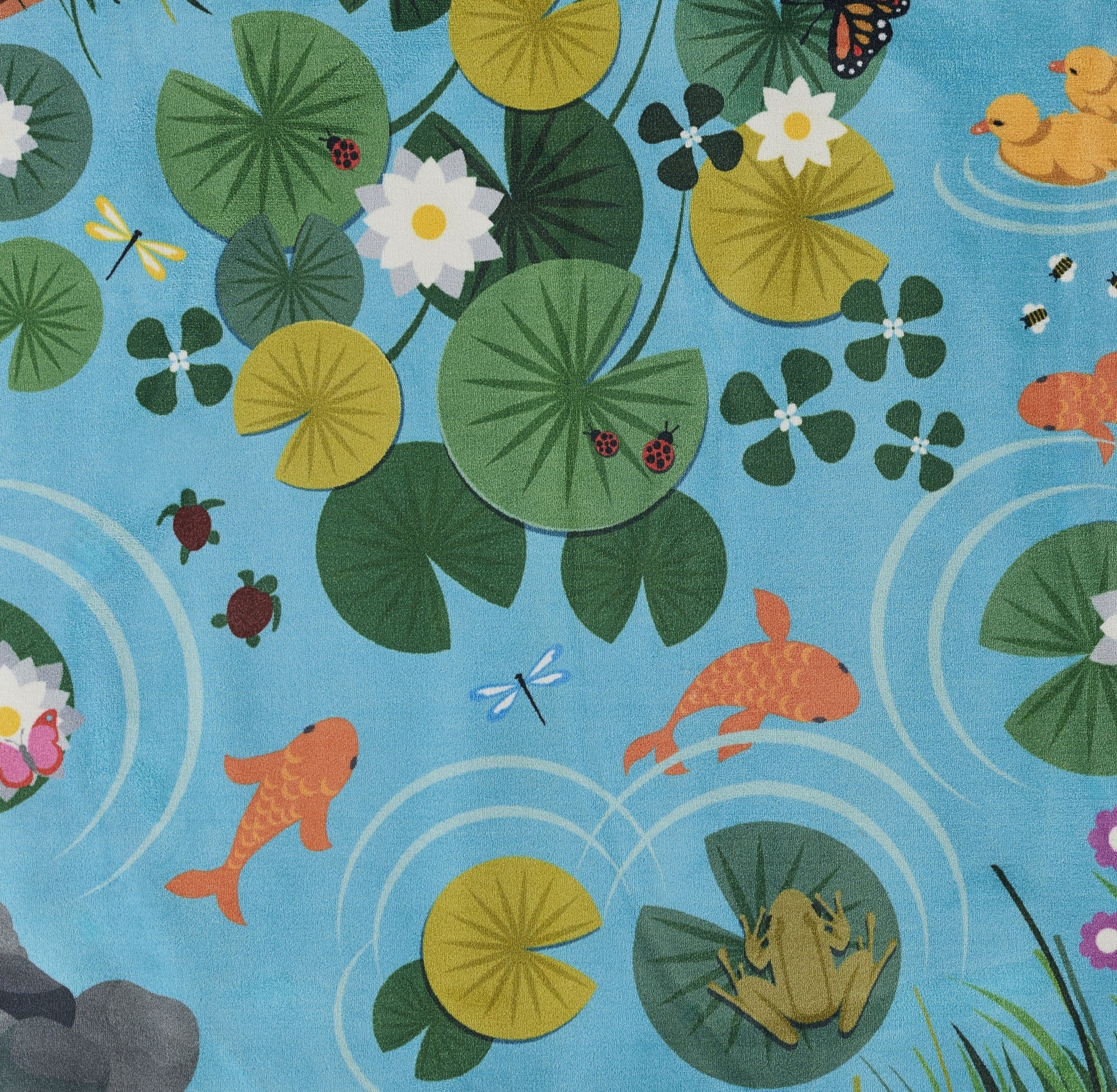Blue pond print rug with green lily pads, white water lilies, orange koi, dragonflies, ducks and ladybugs.