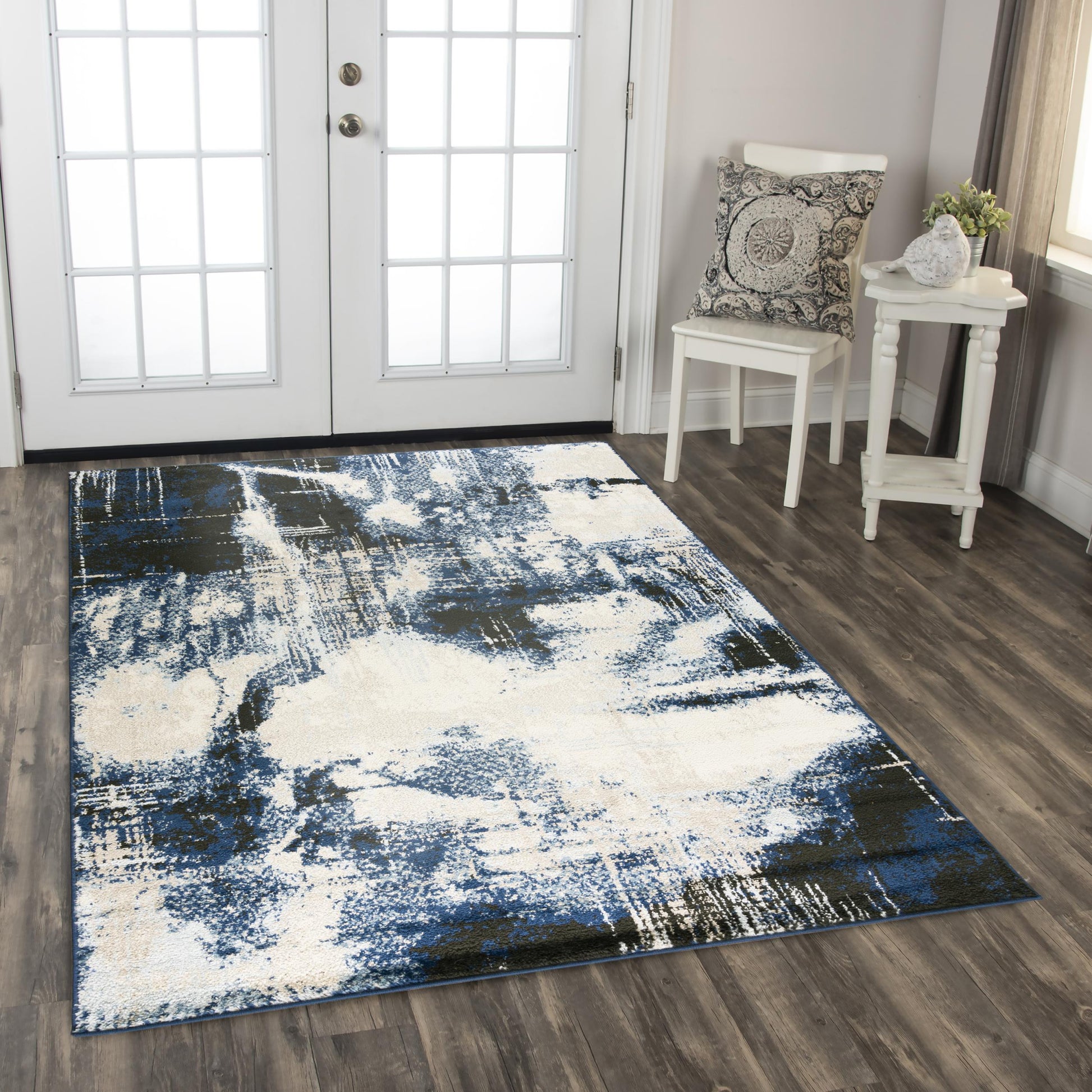 Contemporary rug on floor, 8' x 10'.