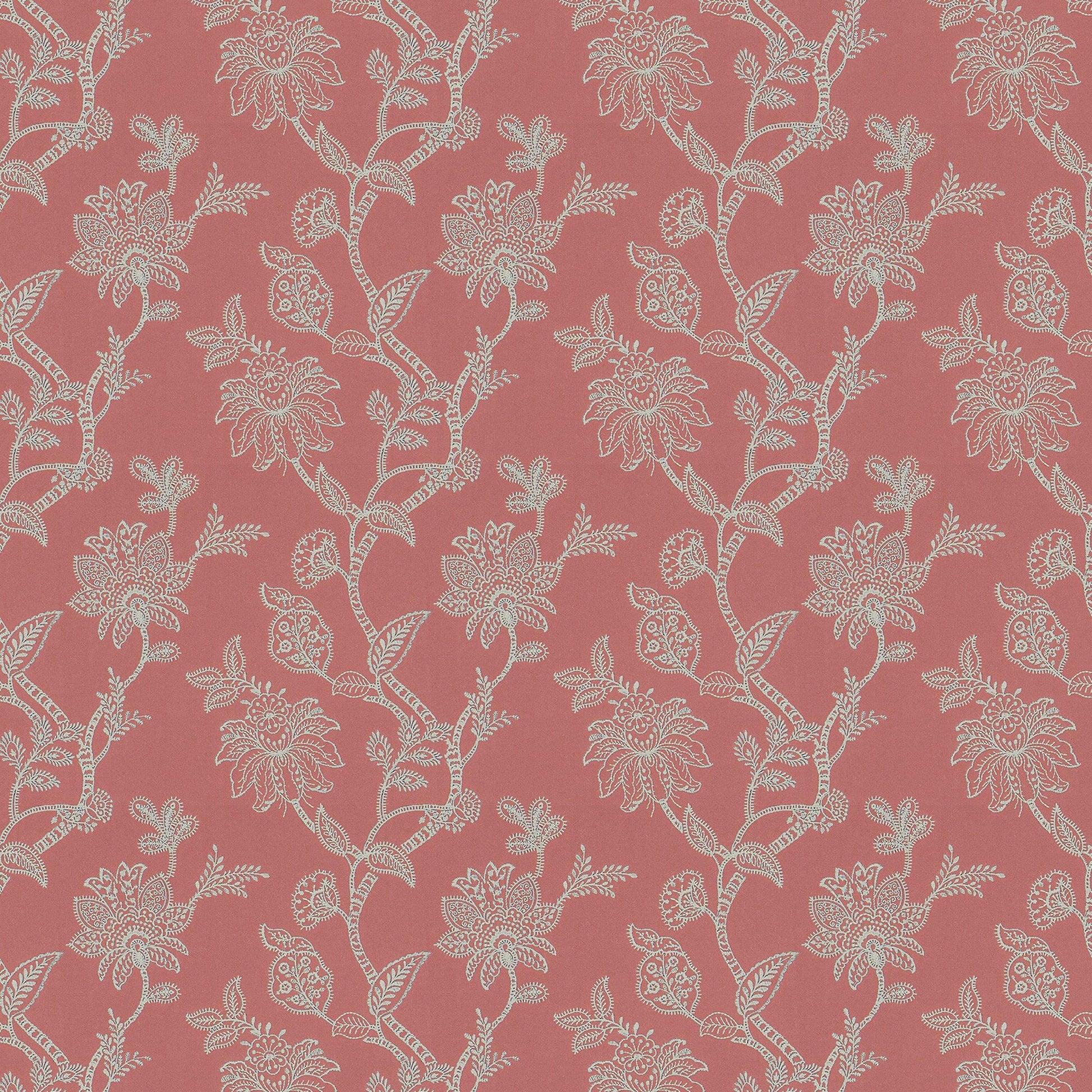 Orange and rust floral damask embroidery on linen-textured fabric.