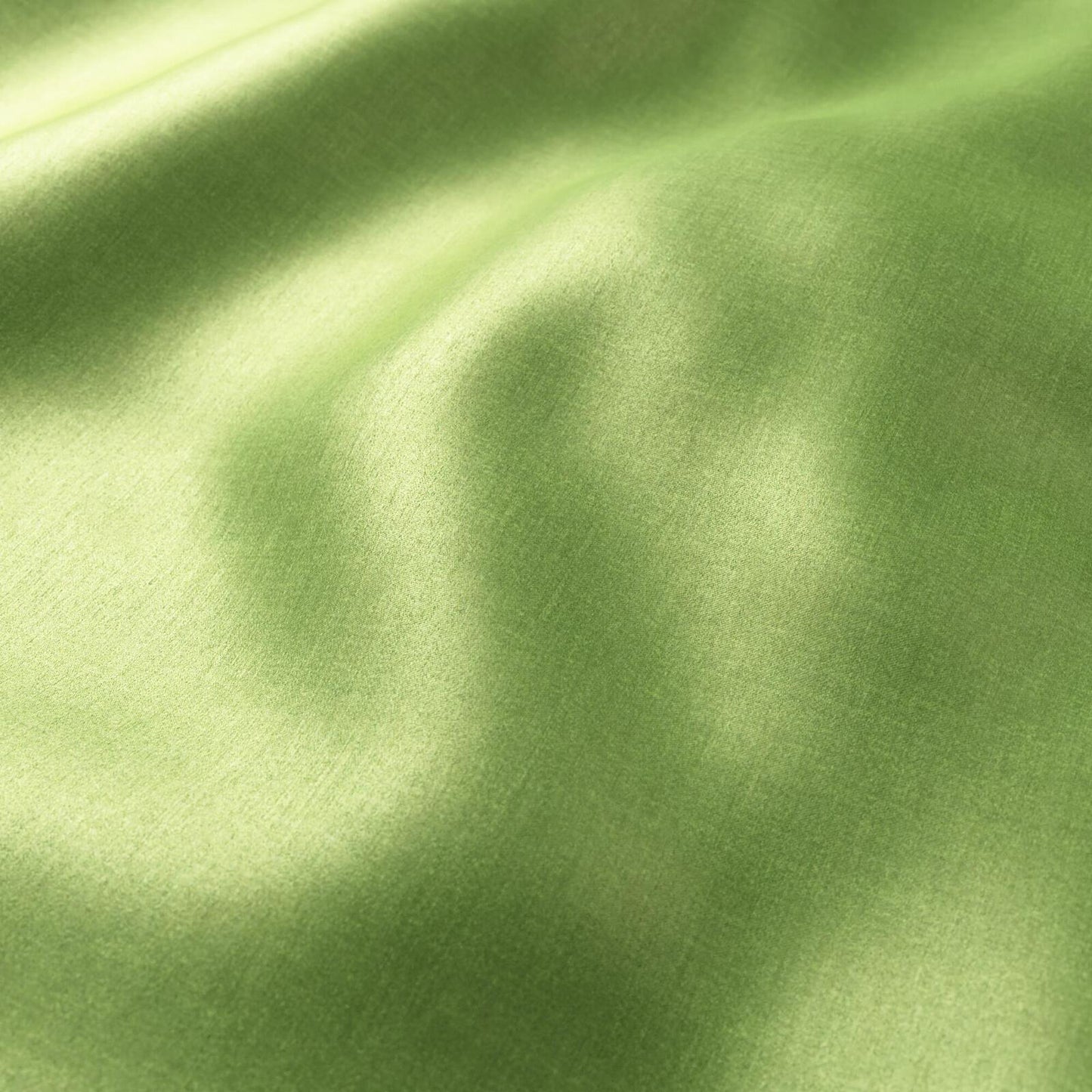 Polished chartreuse green plain sateen fabric with soft folds and silky sheen.