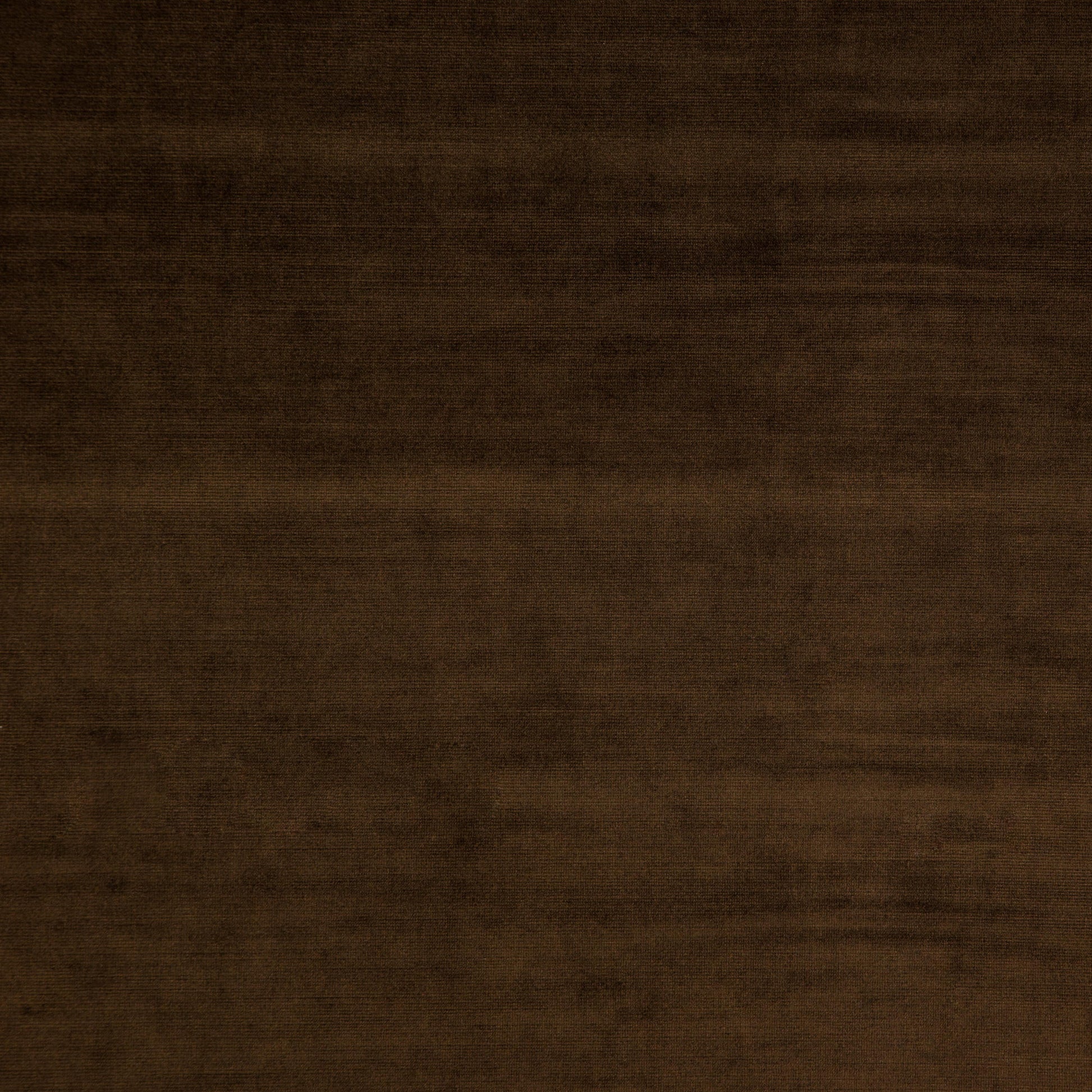 Plain brown velvet fabric swatch with a soft, plush pile.