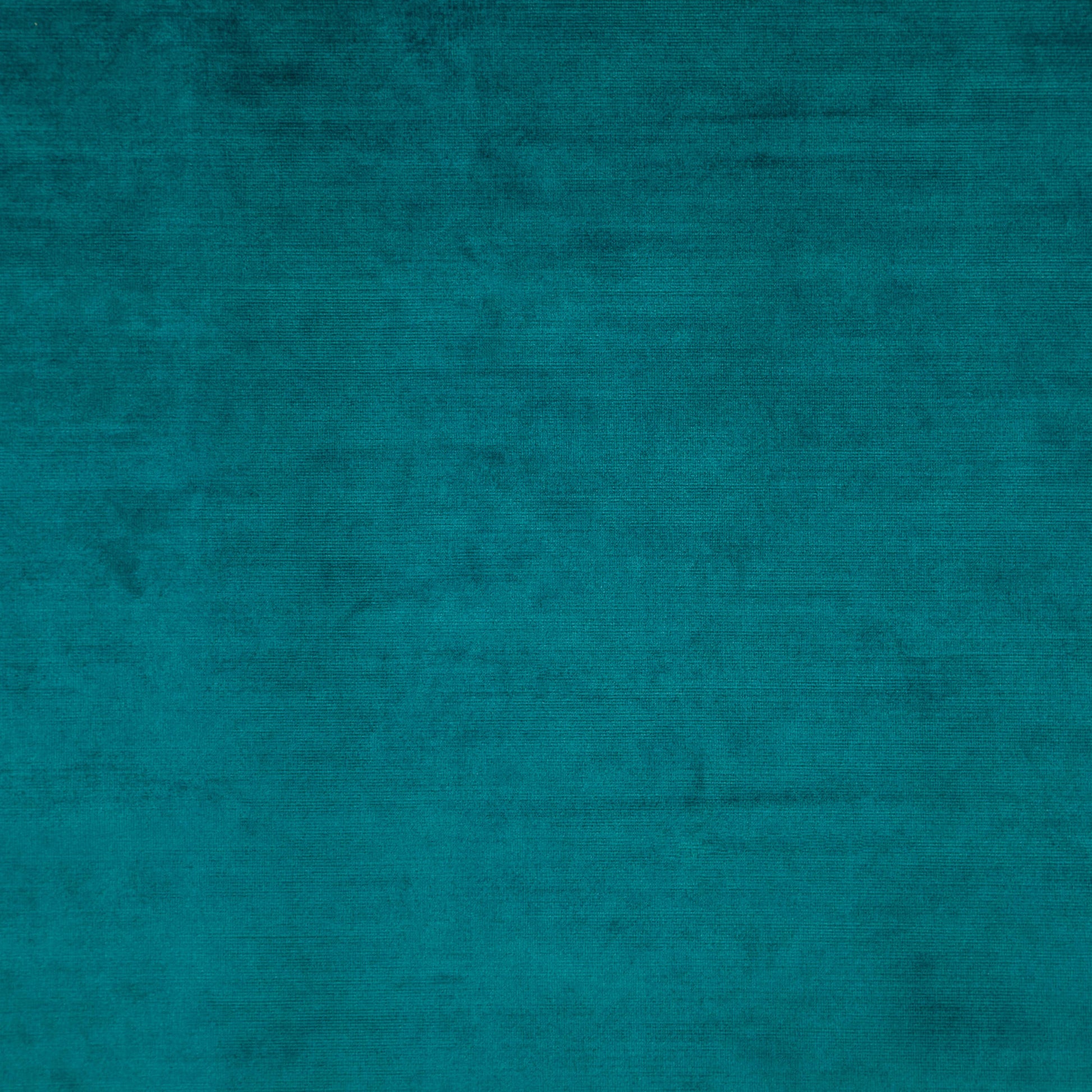 Teal velvet fabric texture with plush nap and subtle mottled shading.