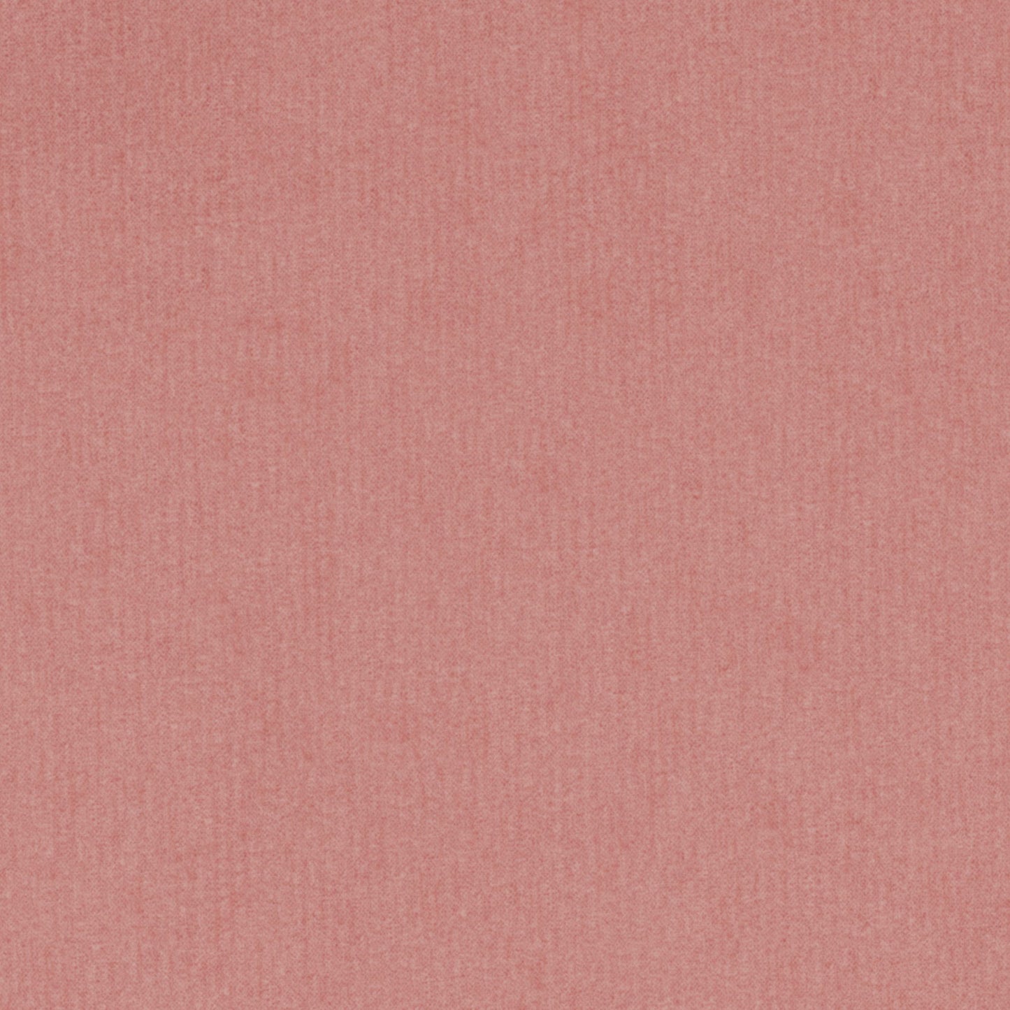 Soft dusty pink velvet fabric close-up with a muted coral hue and fine texture.