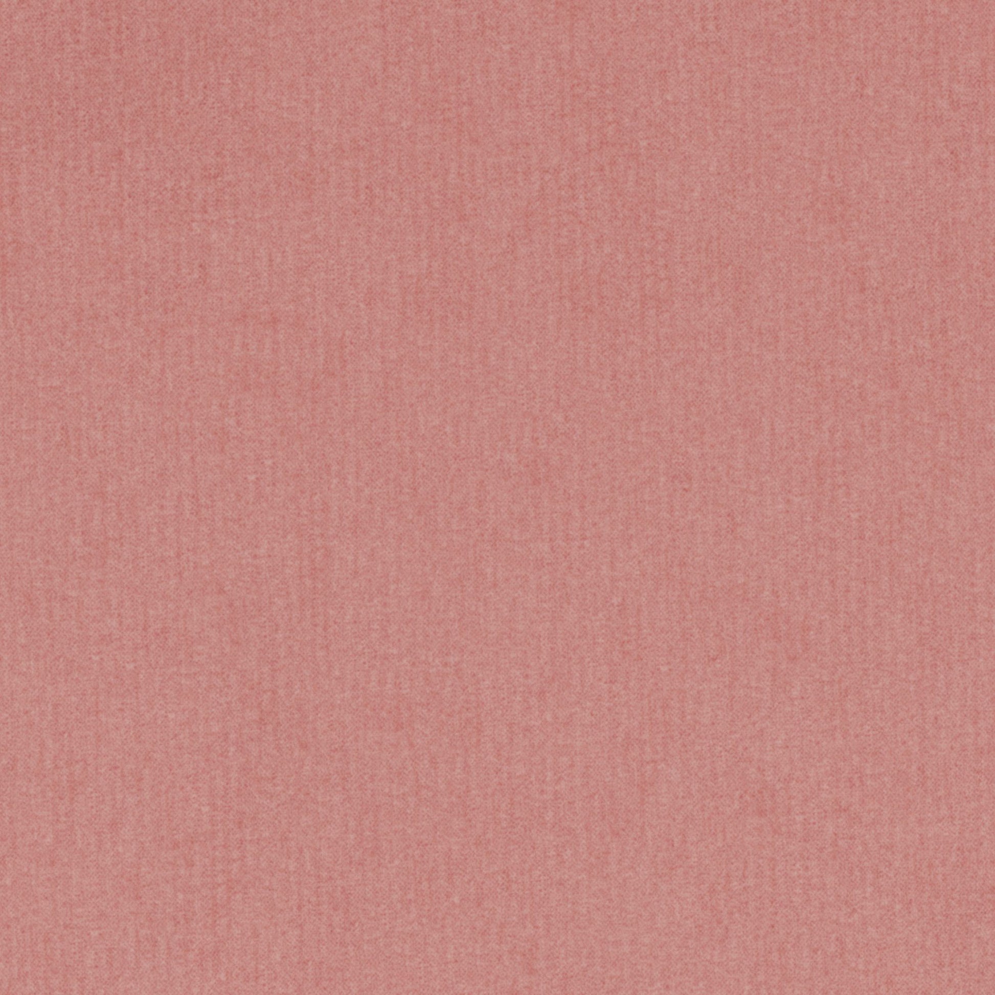Soft dusty pink velvet fabric close-up with a muted coral hue and fine texture.