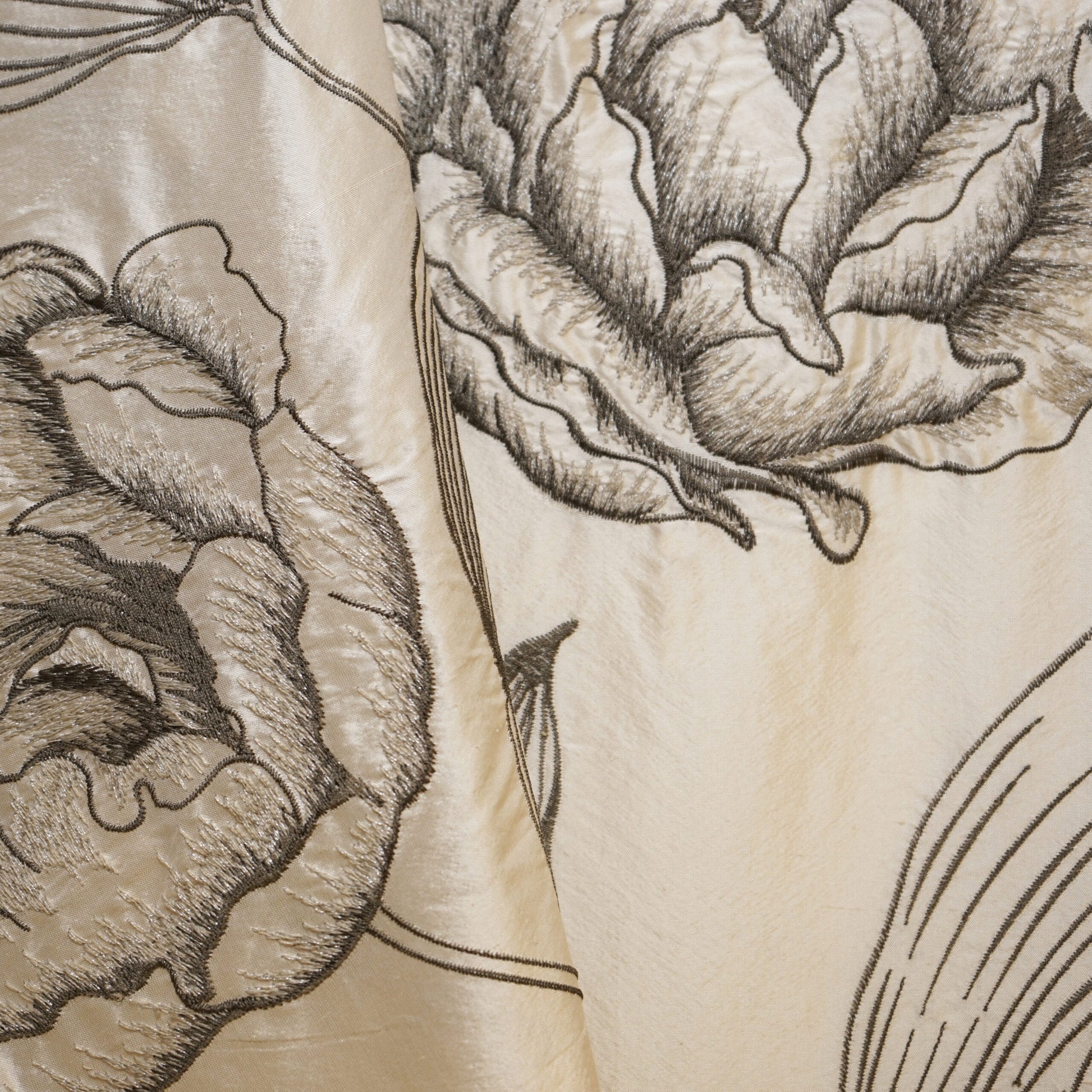Cream fabric with large gray primrose floral print, hand-drawn botanical textile design.