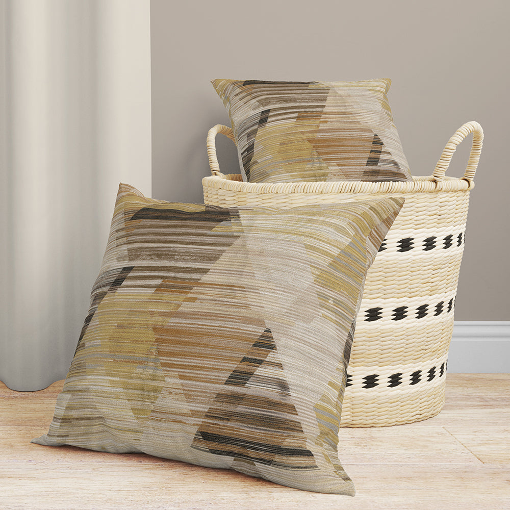Earth-toned prism-pattern fabric with textured weave beside a cream woven basket with black bands.