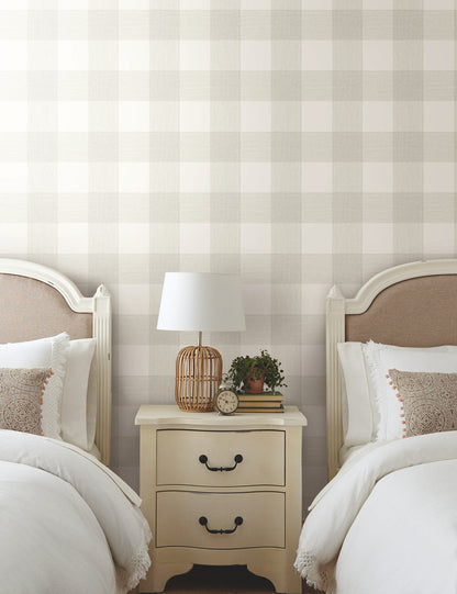 Magnolia Home Common Thread Fog Green Peel & Stick Wallpaper with a large-scale woven plaid design in soft green and cream tones. Washable, fully removable wallpaper for creating a timeless accent wall in bedrooms, kitchens, bathrooms, entryways, offices, and cozy farmhouse or cottage-style spaces.