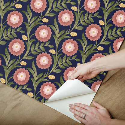 Lillian Blue Floral Vine peel and stick wallpaper by Mirth Studios — rich deep blue background with leafy green vines and pink blooms, non‑woven removable self‑adhesive wallcovering roll, ideal for accent walls in living room, bedroom or nursery.