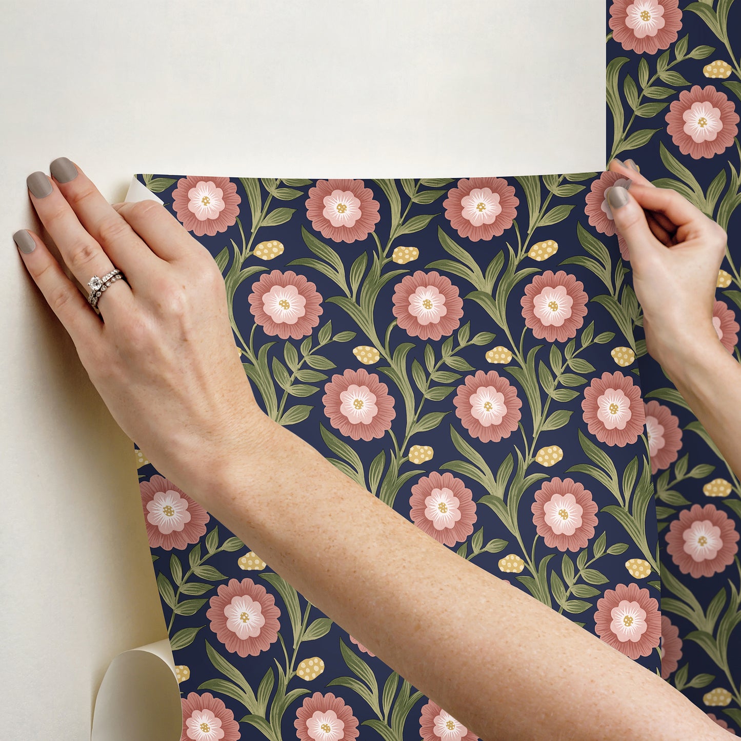 Lillian Blue Floral Vine peel and stick wallpaper by Mirth Studios — rich deep blue background with leafy green vines and pink blooms, non‑woven removable self‑adhesive wallcovering roll, ideal for accent walls in living room, bedroom or nursery.