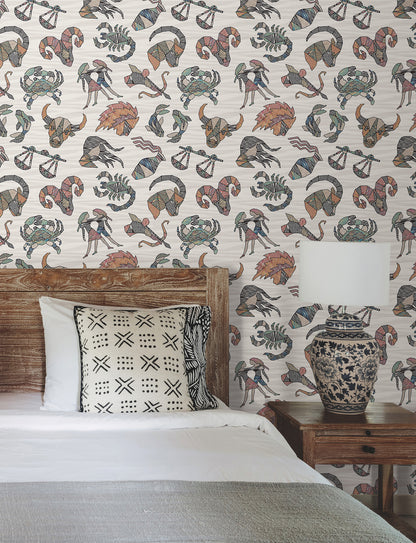 Peel-and-stick wallpaper in multicolor featuring zodiac motifs over flame-stitch background, Missoni PSWP Constellations pattern PSW1644RL.