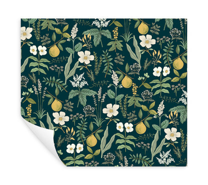 Navy peel-and-stick wallpaper with white flowers, green leaves and yellow citrus fruits; botanical pattern.