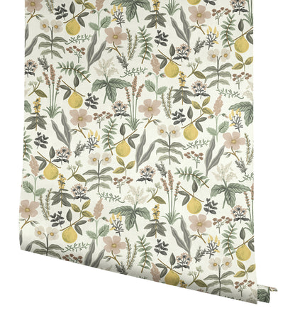 Botanical wallpaper roll featuring yellow lemons, pastel pink flowers and green leaves on cream background.