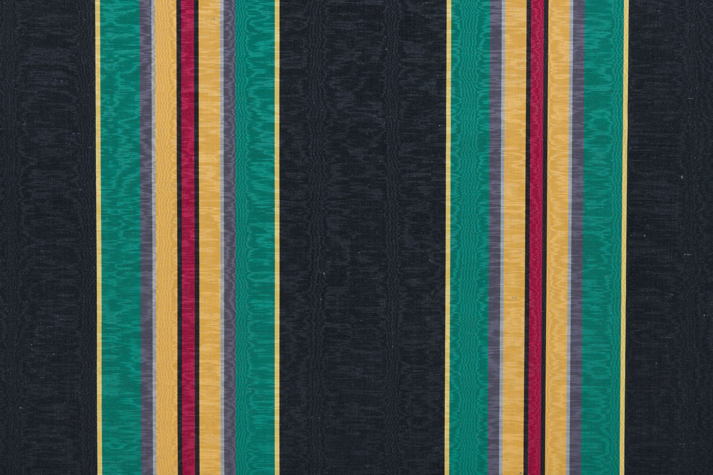 Black moire fabric with bold vertical stripes in teal, gold, gray and burgundy; modern striped textile.