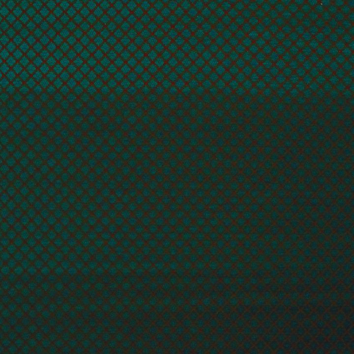 Close-up of teal diamond lattice pattern on fabric.