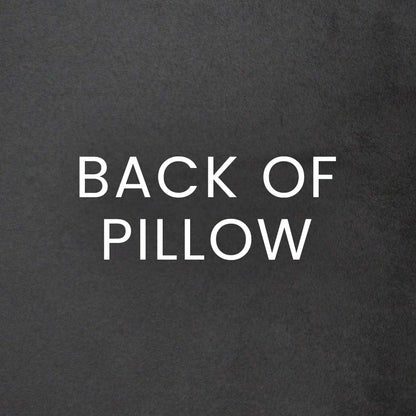 Charcoal pillow with a textured surface and abstract circular dot pattern.