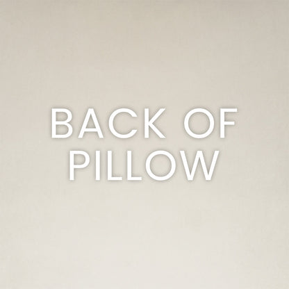 Back view of a beige pillow with soft fabric and subtle texture; neutral minimalist decor.