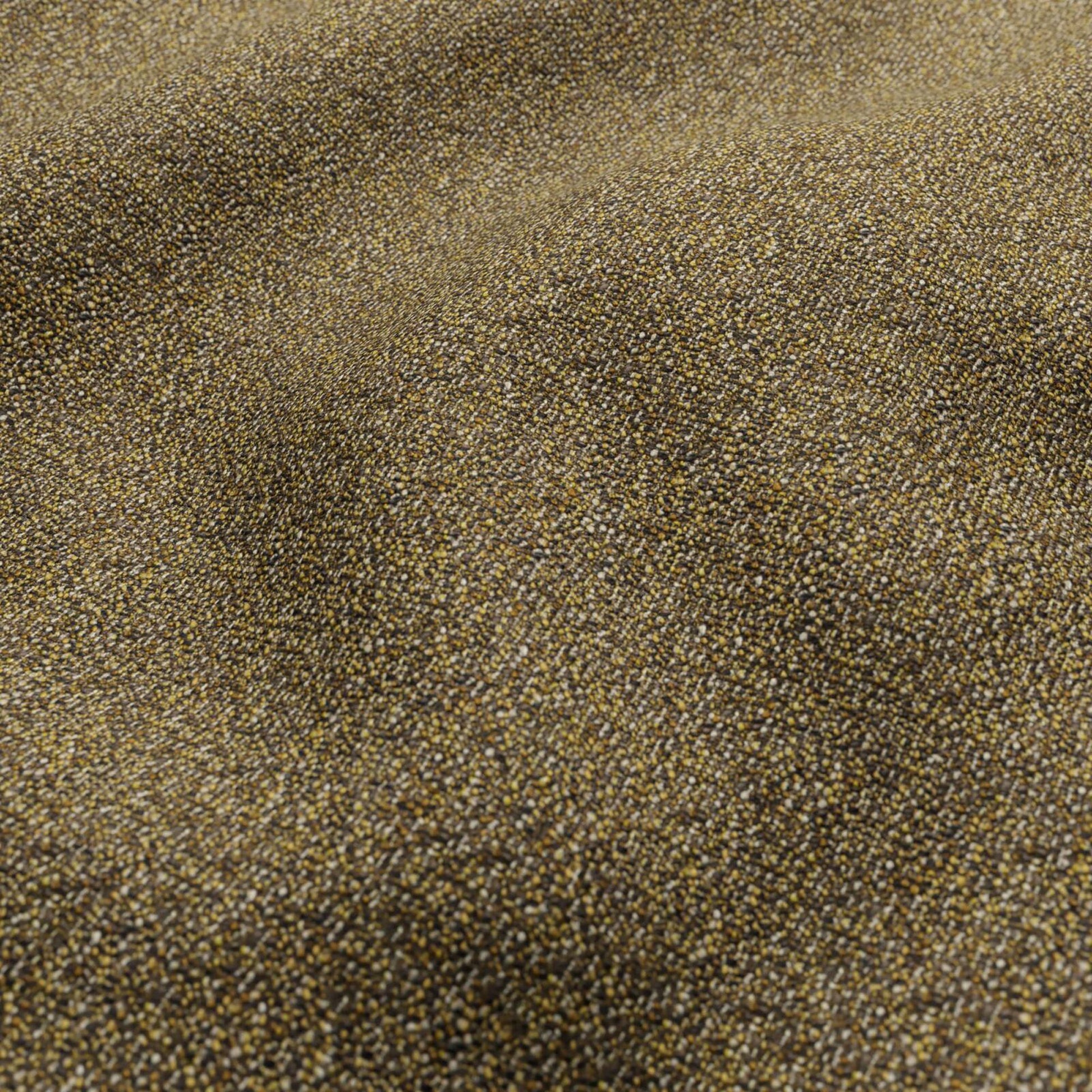 Close-up of bronze-gold metallic boucle fabric with a tiny speckled texture and soft shimmer.