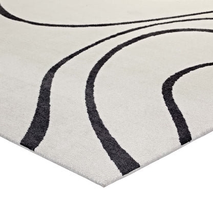 Ivory and charcoal abstract swirl rug with a soft pile for contemporary living spaces.