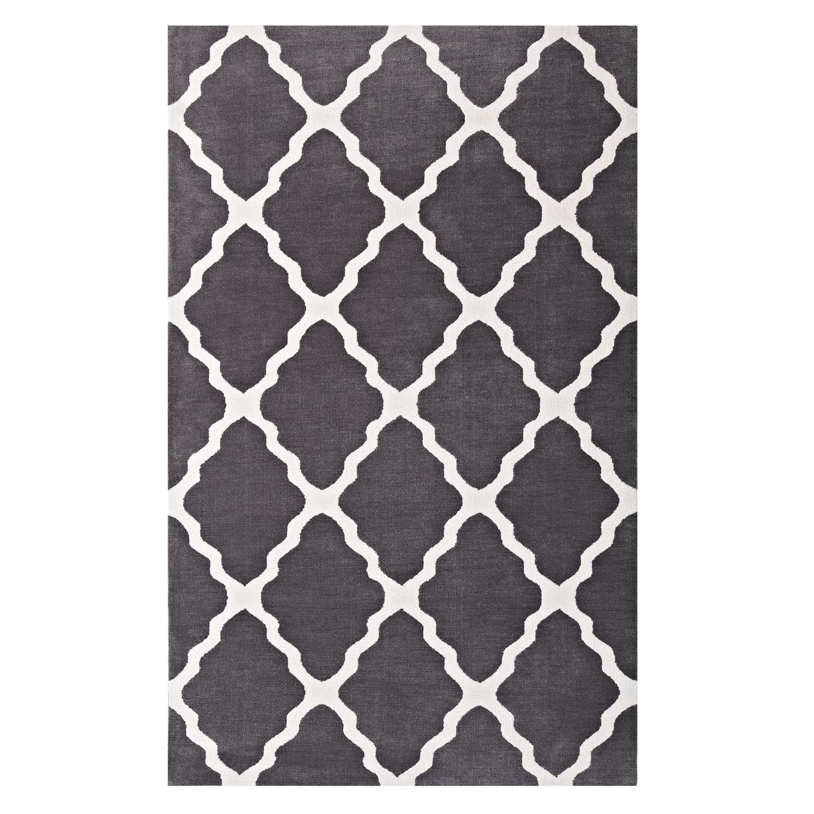 Charcoal gray rug with white trellis quatrefoil lattice pattern.