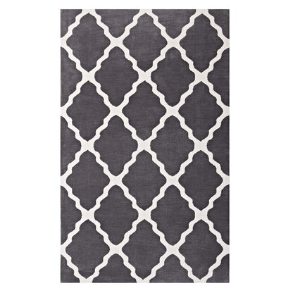 Charcoal gray rug with white trellis quatrefoil lattice pattern.