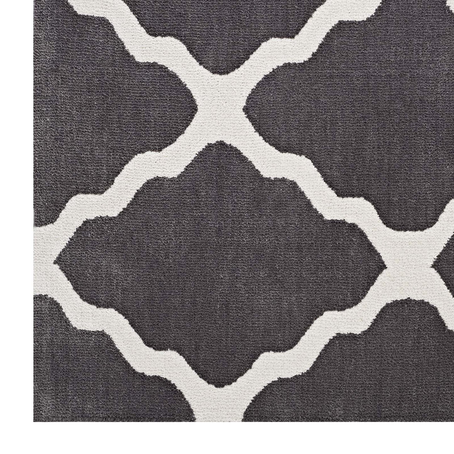 Dark gray rug with cream interlocking lattice pattern and woven texture; modern geometric trellis design.