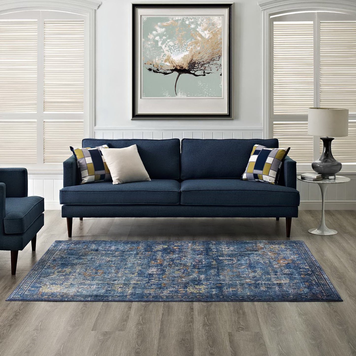 Dark blue 4x6 area rug with a distressed floral lattice pattern in yellow and orange.