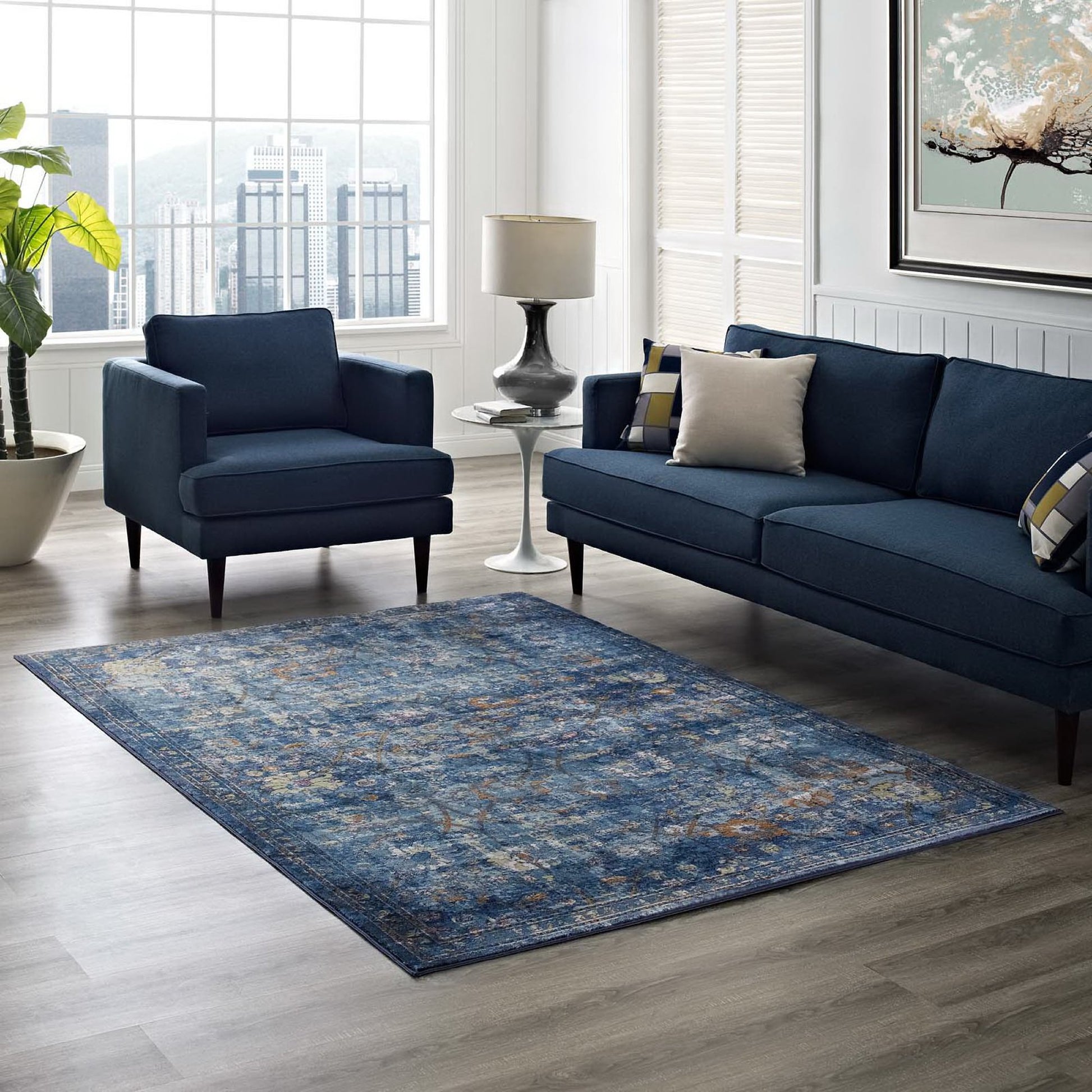 Dark blue 4x6 area rug with distressed floral lattice pattern and yellow and orange accents.