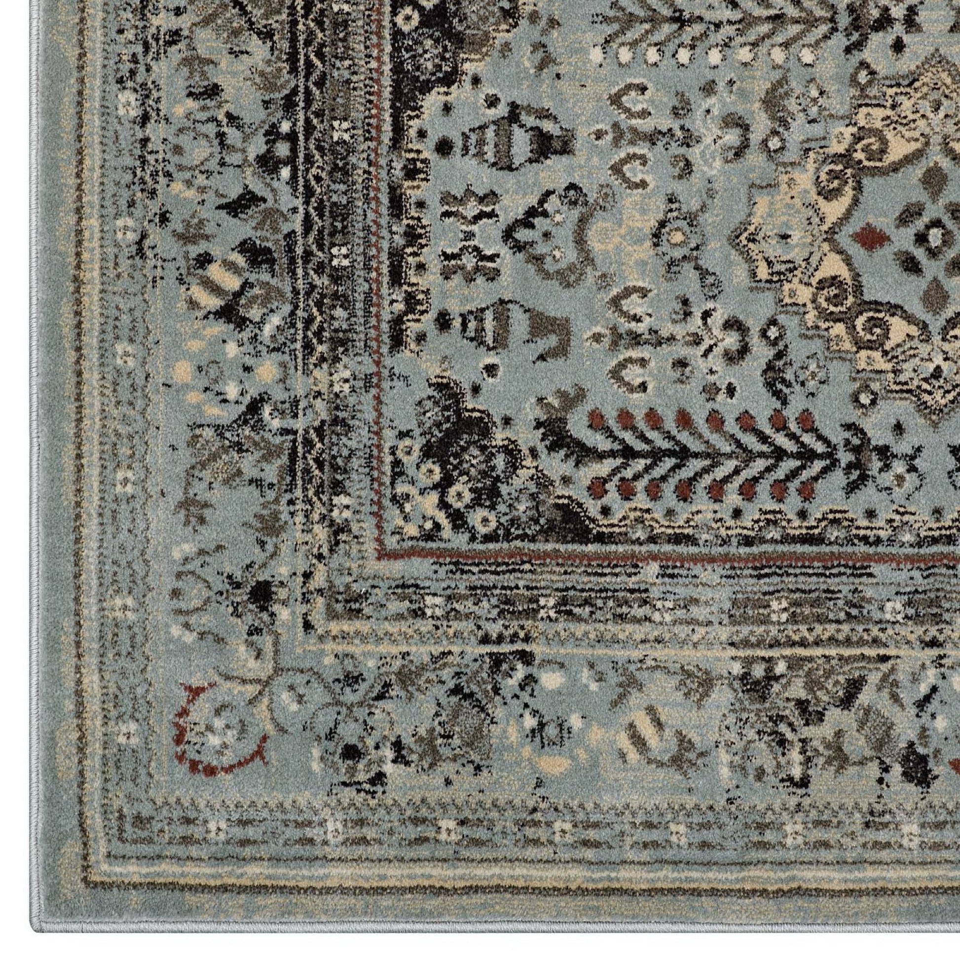 Blue-gray oriental rug with a multi-layer beige border, cream/brown floral motifs, and a distressed vintage look.