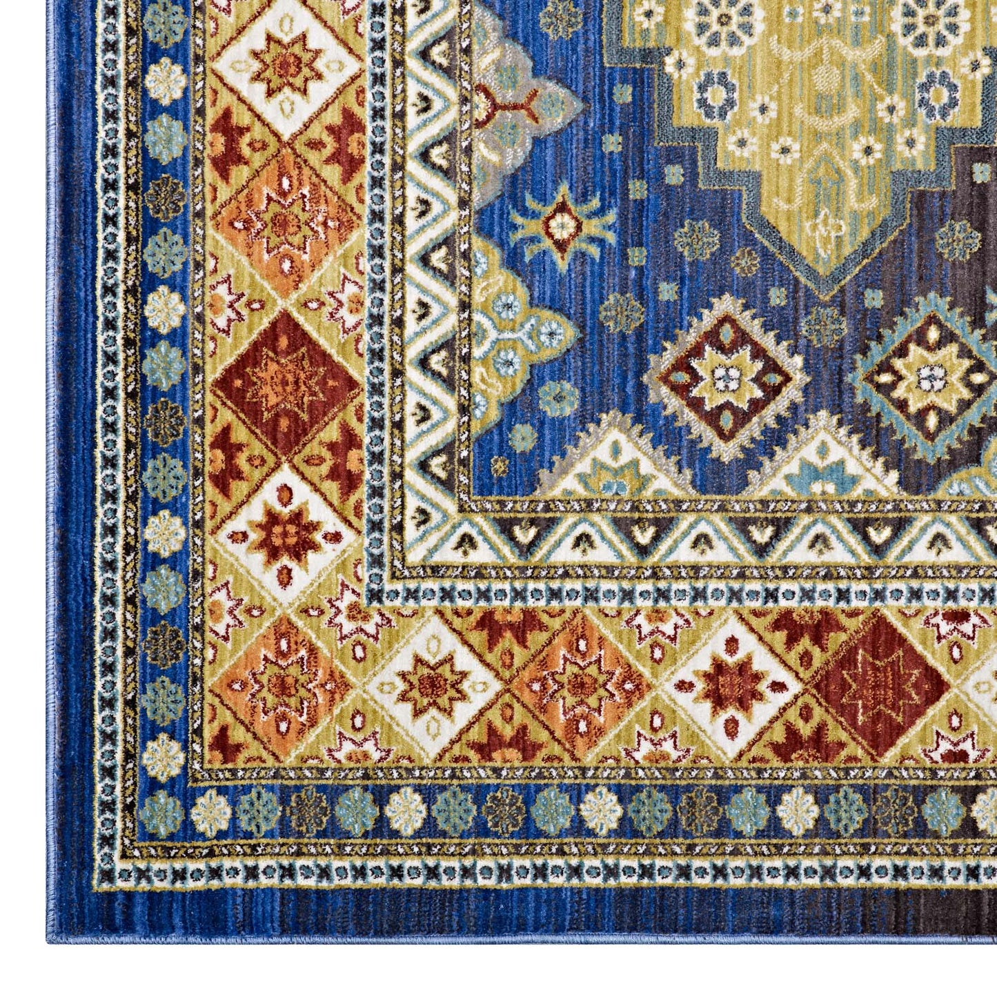 Close-up of a blue and gold oriental rug with diamond medallions, cream borders, and intricate geometric motifs.
