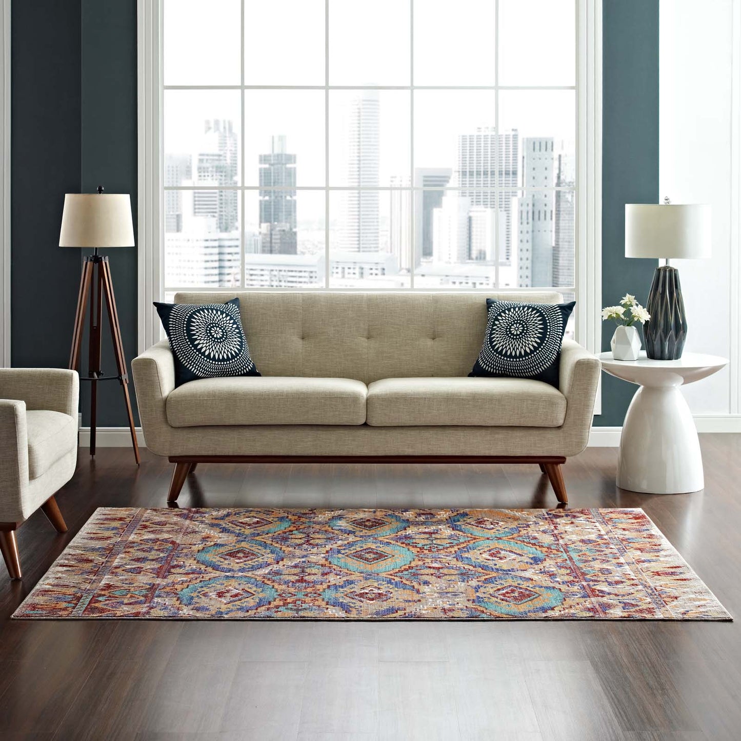Distressed Southwestern Aztec multicolored 8x10 area rug on the floor in a living room setting.