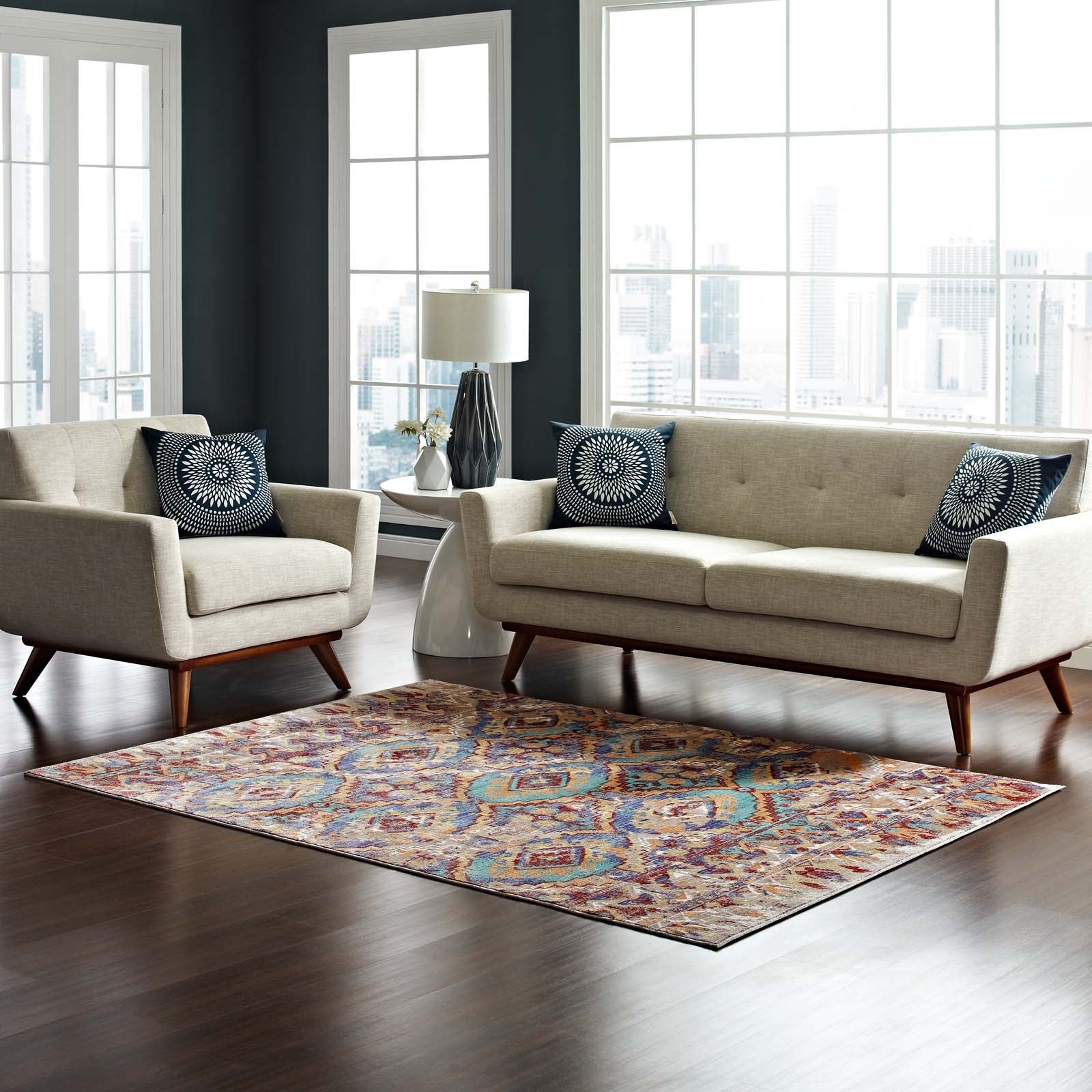 Multicolored distressed Southwestern Aztec area rug in a living room.