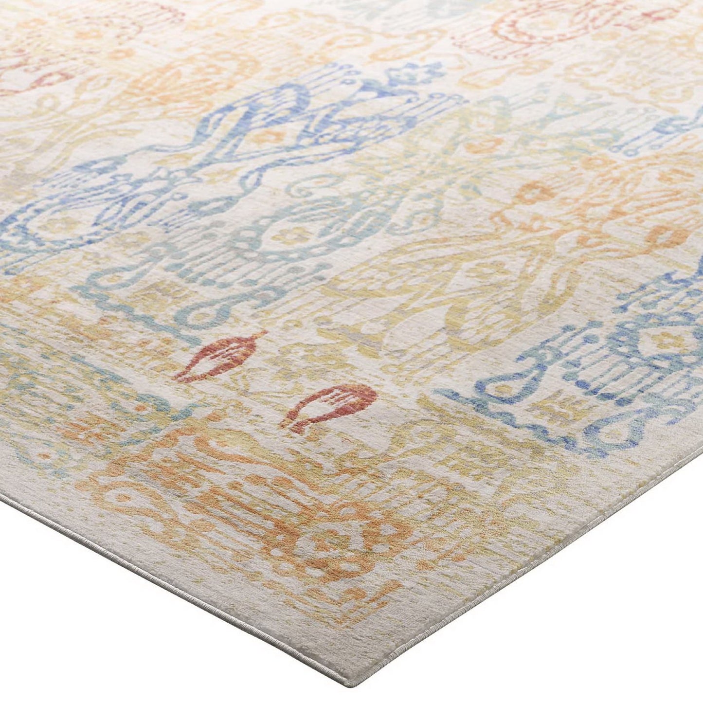 Rectangular distressed Southwestern Aztec 4x6 area rug, multicolored with faded geometric motifs in blue, peach and yellow on an ivory ground.