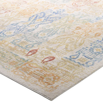 Rectangular distressed Southwestern Aztec 4x6 area rug, multicolored with faded geometric motifs in blue, peach and yellow on an ivory ground.