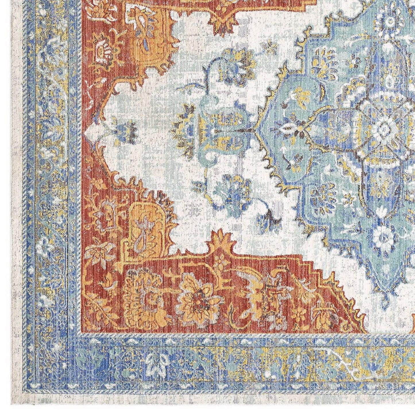 Southwestern Aztec-inspired multicolored area rug with a geometric motif.
