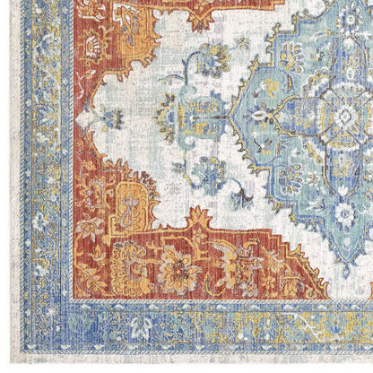Southwestern Aztec-inspired multicolored area rug with a geometric motif.