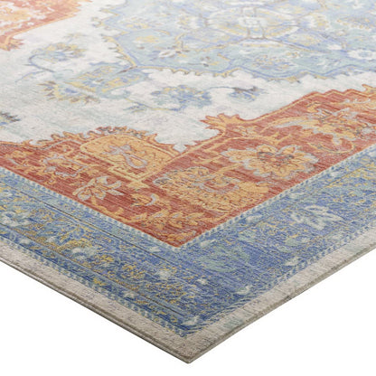 Southwestern Aztec patterned area rug with multicolored geometric motifs.