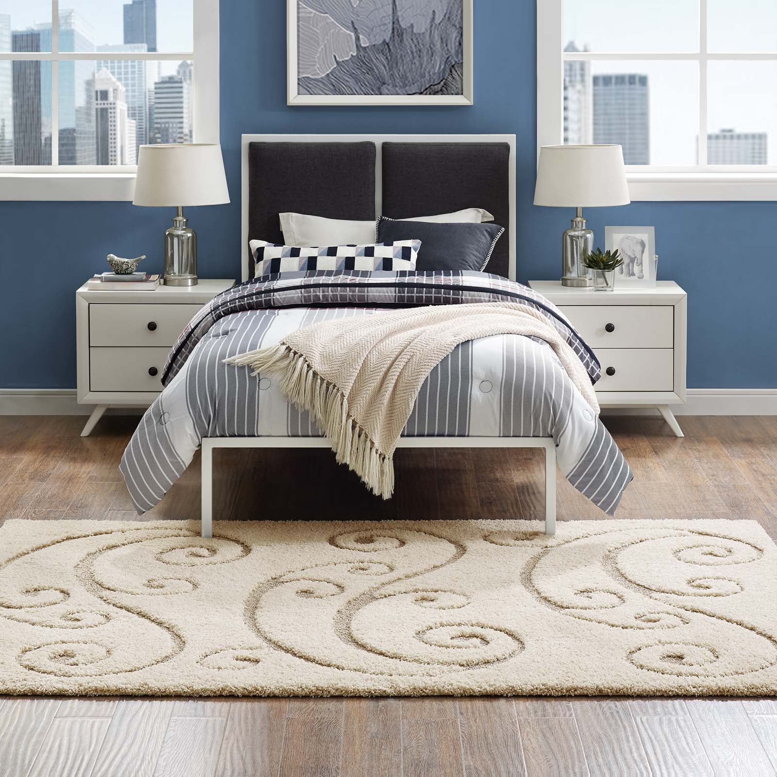 Cream and beige scrolling vine shag area rug, 8x10, on the floor.