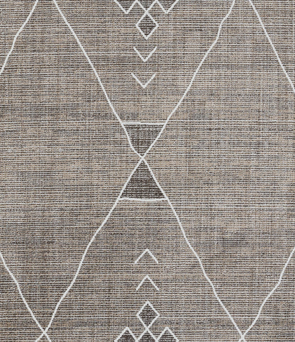 Gray woven rug with white geometric diamond pattern, contemporary boho-style.