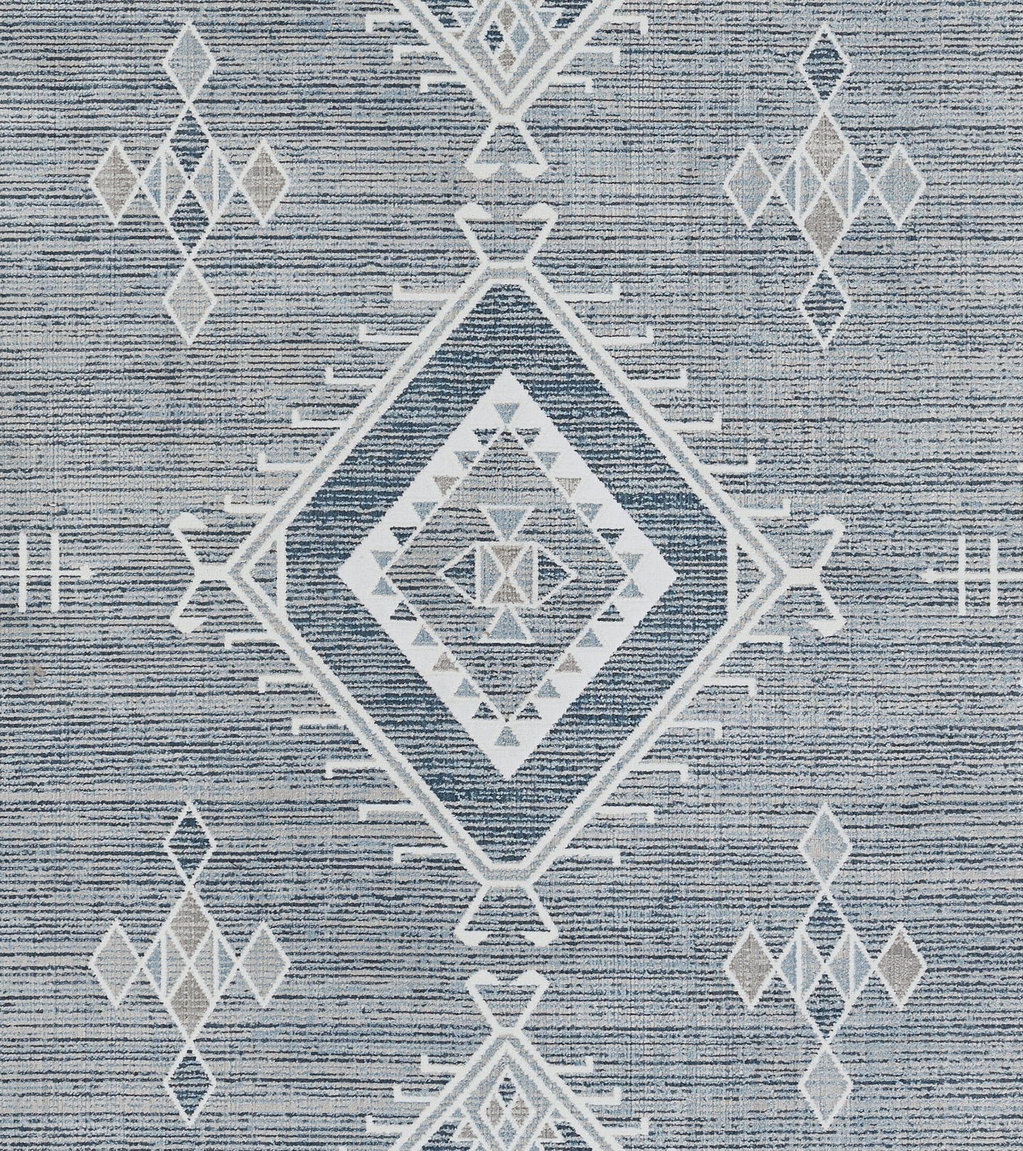 Blue woven rug with white geometric diamonds, including a central nested diamond motif.